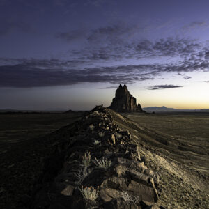 Shiprock and volcanic ridge in morning blue hour light