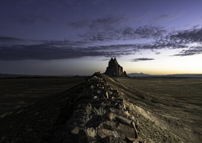 Shiprock and volcanic ridge in morning blue hour light