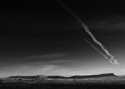 Sunrise near the tiny town of San Luis NM with 2 early morning contrails flying over the San Luis Mesa