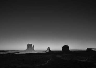 Long shadows at Monument Valley during sunset