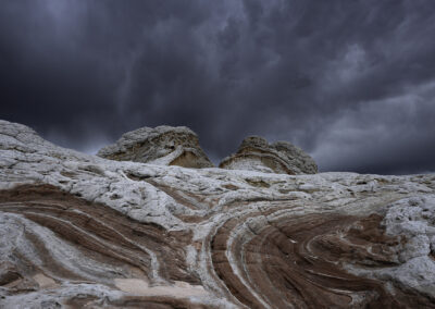 Surreal rock formations against a stormy afternoon sky