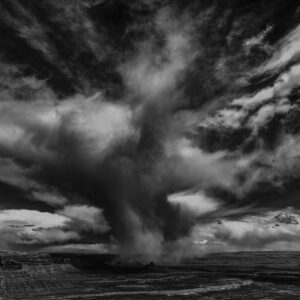 Snow burst rolls off Cedar Mesa and over the Valley of the gods