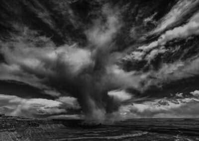 Snow burst rolls off Cedar Mesa and over the Valley of the gods