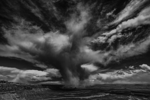 Snow burst rolls off Cedar Mesa and over the Valley of the gods