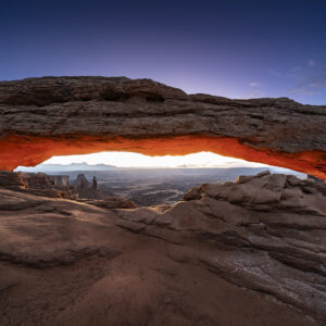 Twilight glow before sunrise at Mesa Arch in Canyonlands NP