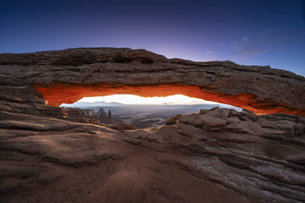 Twilight glow before sunrise at Mesa Arch in Canyonlands NP