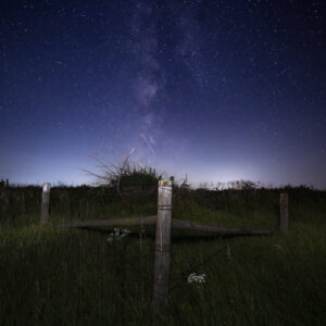 Country Fence along a dark country gravel road in Iowa under the Milky Way