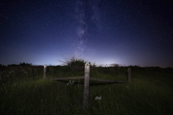 Country Fence along a dark country gravel road in Iowa under the Milky Way