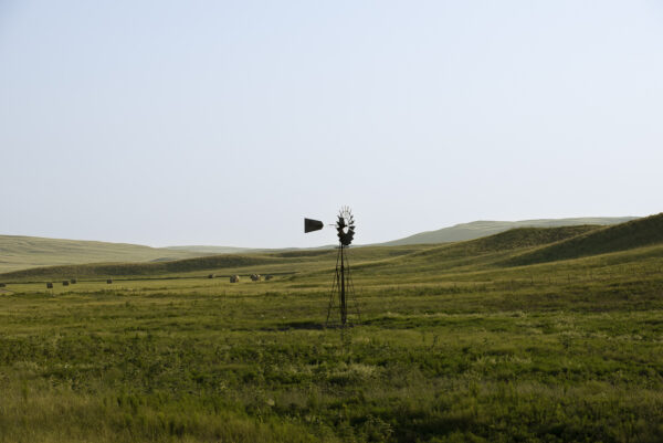 A lone windmill in the middle of the Nebraska Sandhills